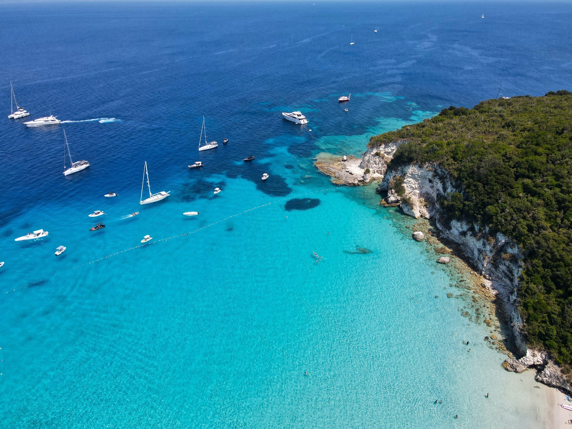 Aerial view, turquoise cove and boats, Greece